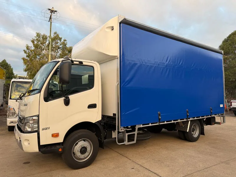 Unbranded blue curtain sider truck body manufactured by Kirin in Queensland
