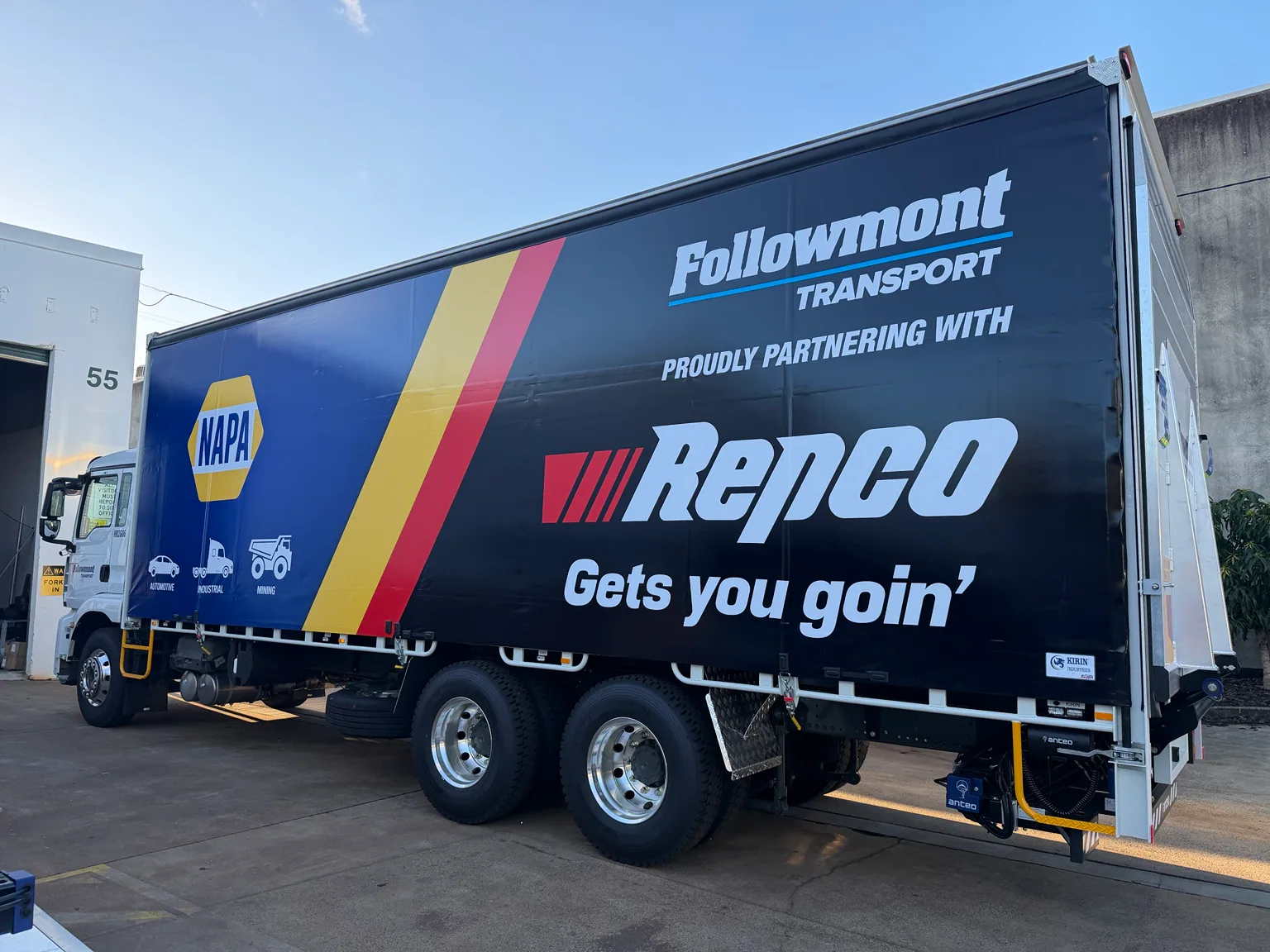 Side view of the Followmont Transport 14-pallet curtain-sider showing the NAPA and Repco partnership livery